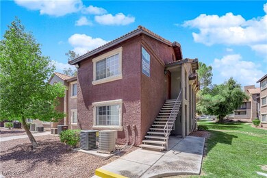 Multi unit property with a front lawn, stucco sidi