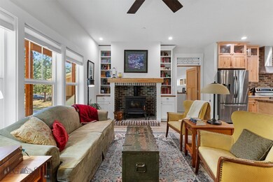 Living Room with Wood Burning Fireplace and Built