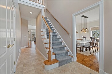 Welcome in to the main foyer with dining room to y