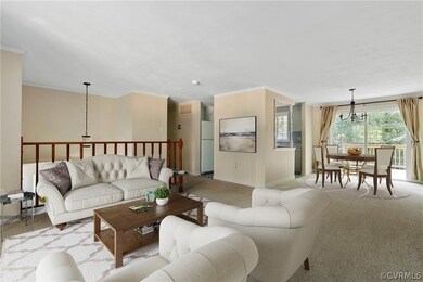 Virtually staged. Carpeted living room featuring o
