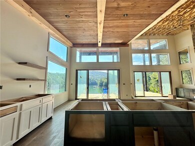 Views from kitchen with stained ceilings and beams *Images shown are for visual representation of a different home site, but SAME floor plan. *