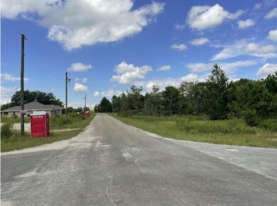 Street scene north on Fisher Lane Trail with the subject to the right