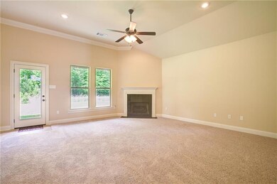 Spacious living area with brand new carpet and cor