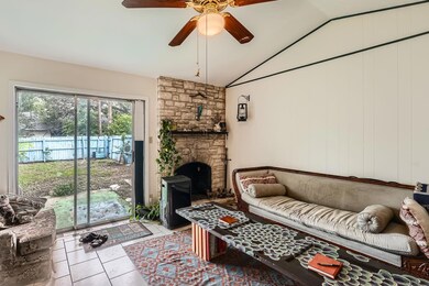 Tiled living room with lofted ceiling and a ceili