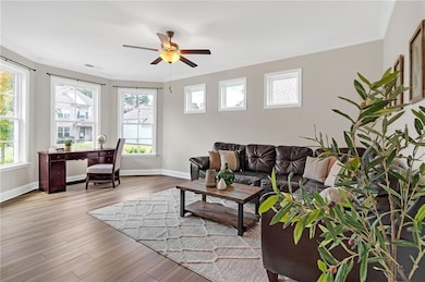 Living room featuring a wealth of natural light, c