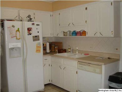Another view of kitchen and cabinets.