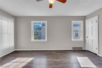 Unfurnished room with wood-type flooring and ceiling fan