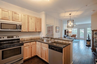 Kitchen featuring appliances with stainless steel