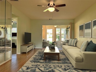 Comfortable living space with living room, dining room and bonus/sun room. Virtually staged.
