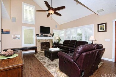 Vaulted ceiling in Living Room w/ new ceiling fan.
