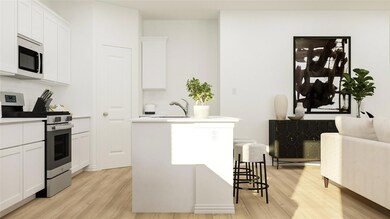 Kitchen with appliances with stainless steel finis