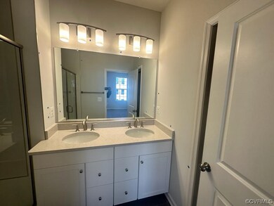 Bathroom featuring dual sinks and oversized vanity