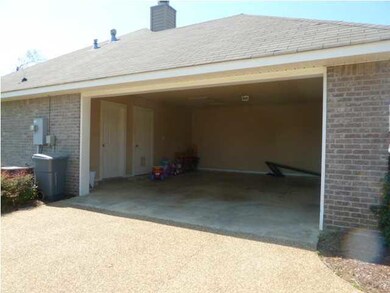 Carport with storage room