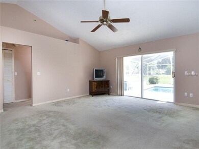 Large living room/great room with sliders leading 