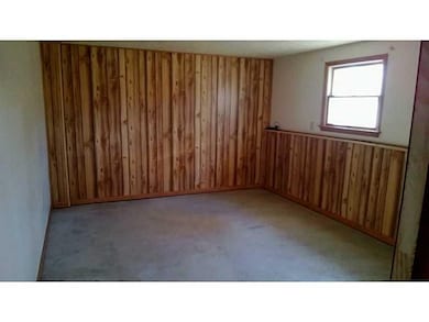 Den. lower level. Room is big and bright. Large wa