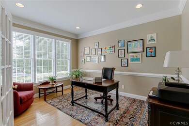 Office off foyer has hardwood floors, recessed lig