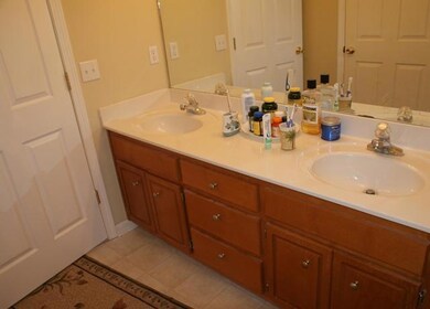 The master bathroom has double sinks, linen closet and a large combo garden tub.