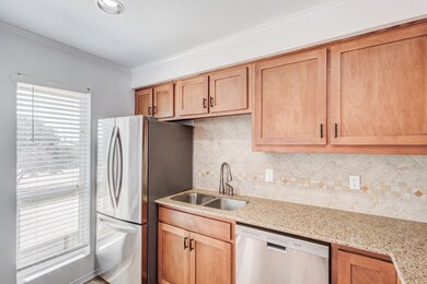 Kitchen with crown molding, sink, appliances with 
