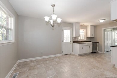 Spacious dining area flows into kitchen and family