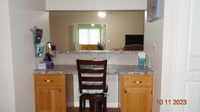 Kitchen pass-through, with large pantry to the right