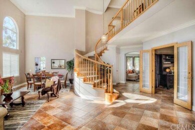 Dramatic curved staircase adds elegance to home.