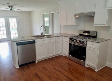 Gas stove and dishwasher in kitchen