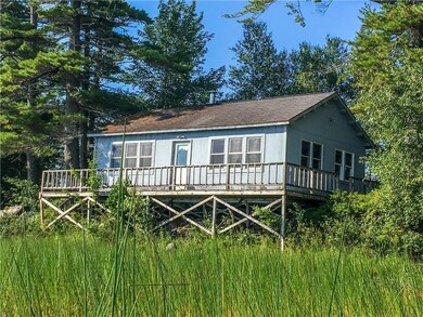 Front view of the cabin with wrap...
