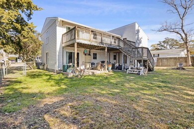Rear view of property featuring a deck, stairway, 