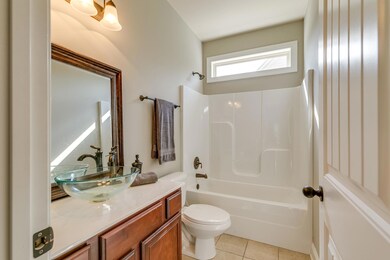 Full bath on the main floor with vessel sink.
