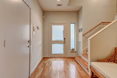 Walking inside, the 2 car garage is on your right