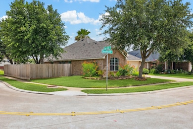 On a spacious corner lot, this brick beauty showca