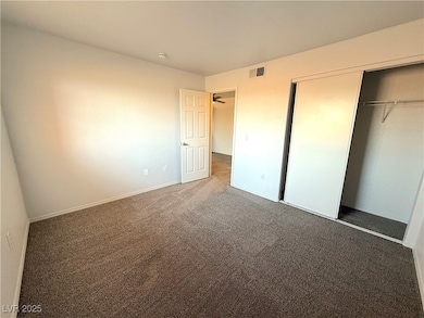Unfurnished bedroom with carpet and a closet