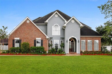 Elegant Front view with grand entryway.