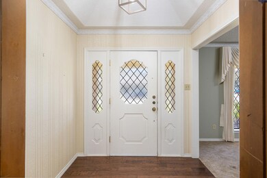 Enter through a pretty leaded glass door.