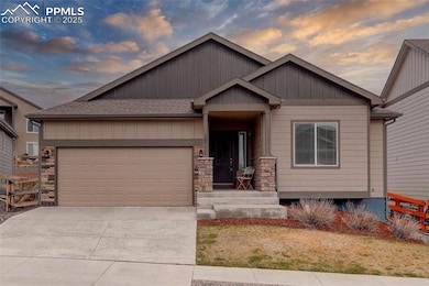 View of front of house with board and batten siding, concrete driveway, a shingled roof, and an attached garage