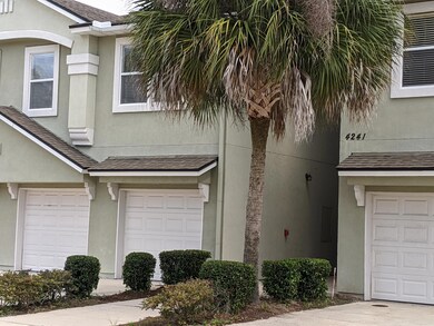 Condo & Garage - Left of Tree