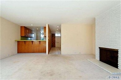 View from living room to kitchen & entry