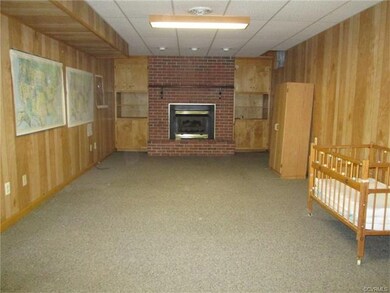 Basement game room or family room. Gas fireplace