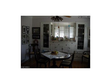 Dining room with built in cabinets, shutters, ceil