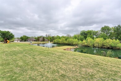 This green space, playground equipment and pond...