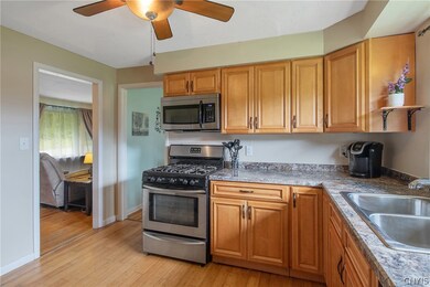 The kitchen was remodeled with new maple cabinets,