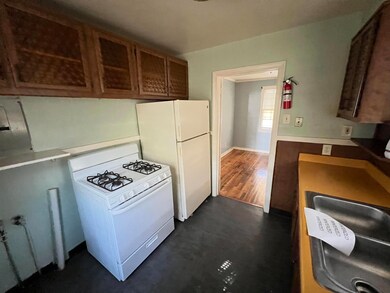 Kitchen featuring dark hardwood / wood-style floor