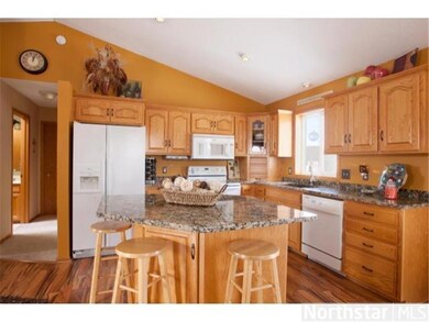 This kitchen island has dual outlets, drawers and 