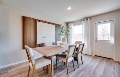 Bright dining area *Photos of furnished model. Not actual home. Representative of floor plan. Some options and features may vary