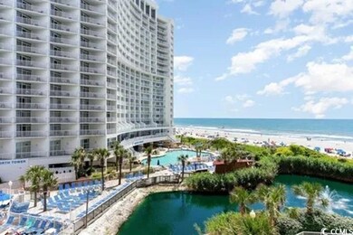 View of pool with a water view