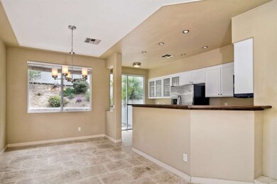 Upgrades include travertine tile flooring, custom 