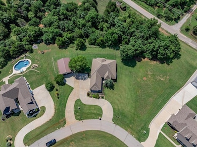 Aerial overview of property's location with a pool