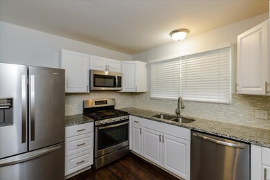 Updated Kitchen with Granite Countertops and Tile 