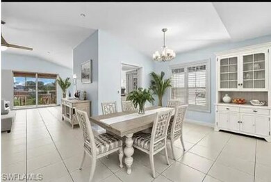 Kitchen featuring light stone counters, a peninsul