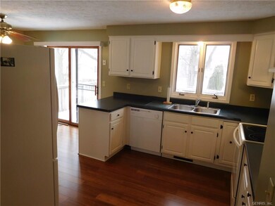Sliding glass door in dining room leads directly o
